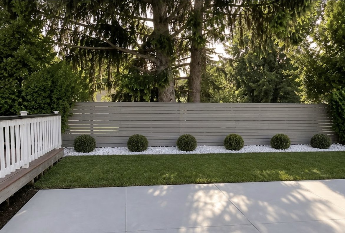 Modern landscaping with trimmed boxwoods and stone bed